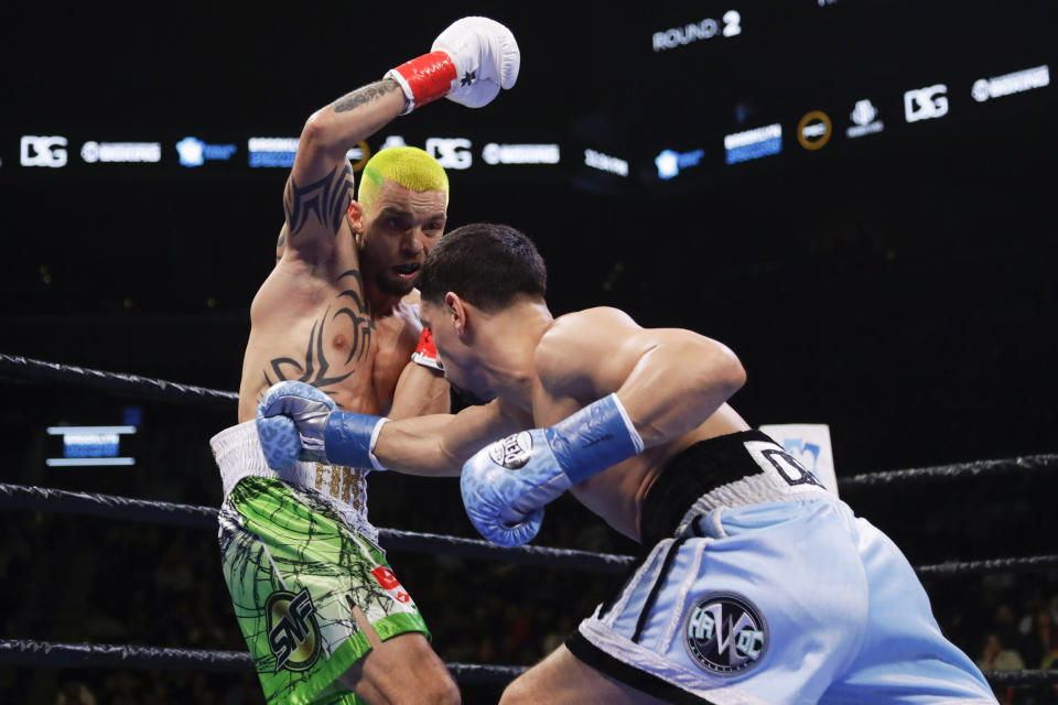 Ukraine's Ivan Redkach, left, evades Danny Garcia during the second round of a welterweight boxing match Saturday, Jan. 25, 2020, in New York. Fulton won the fight. Hurd won the fight. (AP Photo/Frank Franklin II)