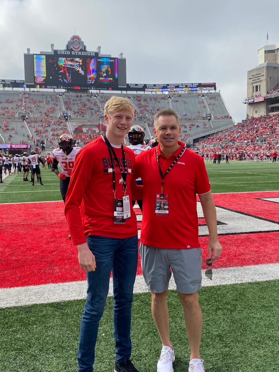 Colin White, a wing from Ottawa (Ohio) Ottawa-Glandorf, poses for a photo with Ohio State men's basketball coach Chris Holtmann at Ohio Stadium on Oct. 9, 2021.