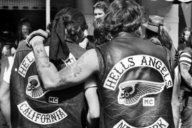 Hells Angels local member from New York consoles mourner from California for Vincent Girolamo outside of Provenzano Funeral Home, 1979. - Credit: Keith Torrie/NY Daily News Archive/Getty Images