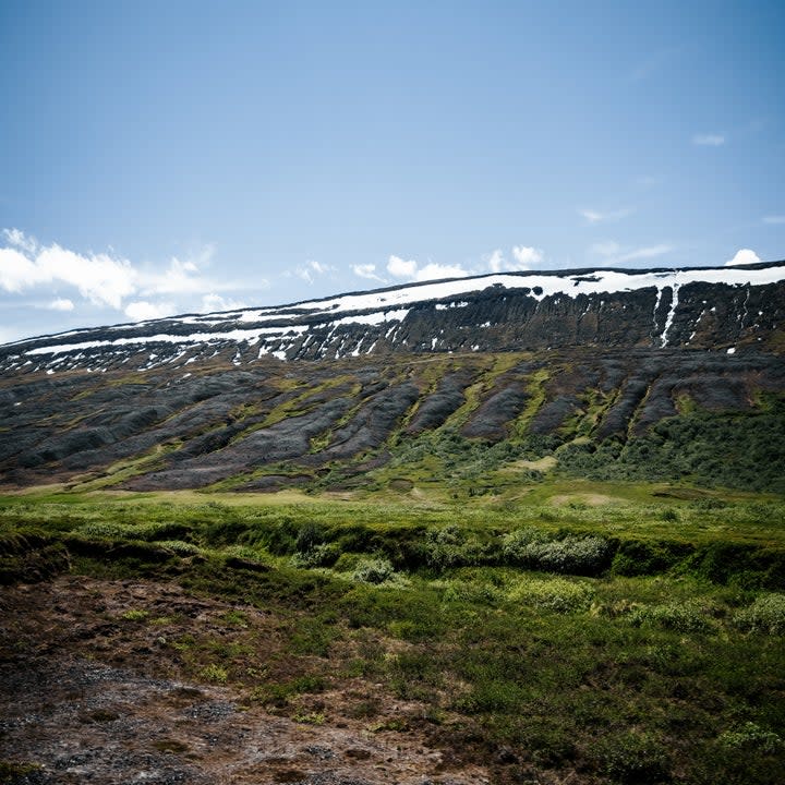 A straight wall of mountains outside Akureyri