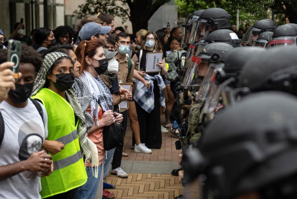 Protesters face a police line during a student demonstration in support of Palestine on the University of Texas campus Wednesday, April 24, 2024, in Austin.