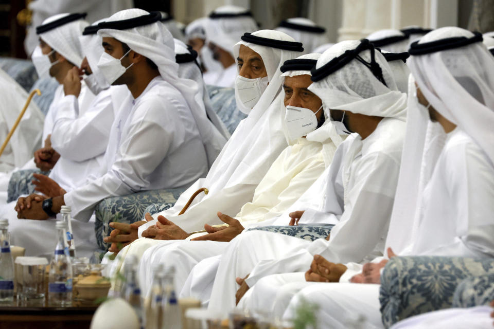 People gather to mourn the death of Sheikh Khalifa Bin Zayed Al Nahyan at Al Mushrif Palace in Abu Dhabi, United Arab Emirates, Sunday, May 15, 2022. (Christian Hartmann, Pool via AP)