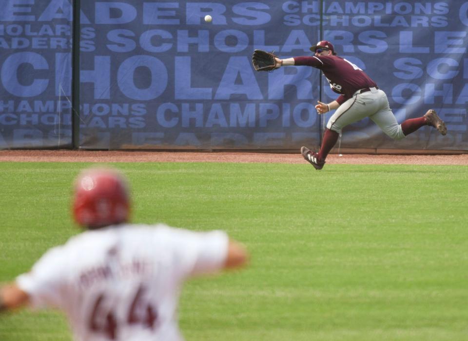 Texas A&M left fielder Ryan Targac makes a difficult running catch against Arkansas during the second round of the SEC Baseball Tournament at the Hoover Met Wednesday, May 24, 2023.