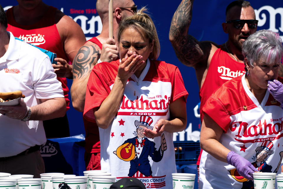Miki Sudo competes in the Nathan's Famous Fourth of July hot dog eating contest in Coney Island on Monday, July 4, 2022, in New York. Sudo ate 40 hot dogs to win the women's division of the contest. (AP Photo/Julia Nikhinson)