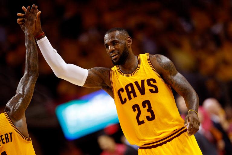 LeBron James of the Cleveland Cavaliers reacts after a play against the Atlanta Hawks, during Game Four of their NBA Eastern Conference finals, at Quicken Loans Arena in Cleveland, Ohio, on May 26, 2015