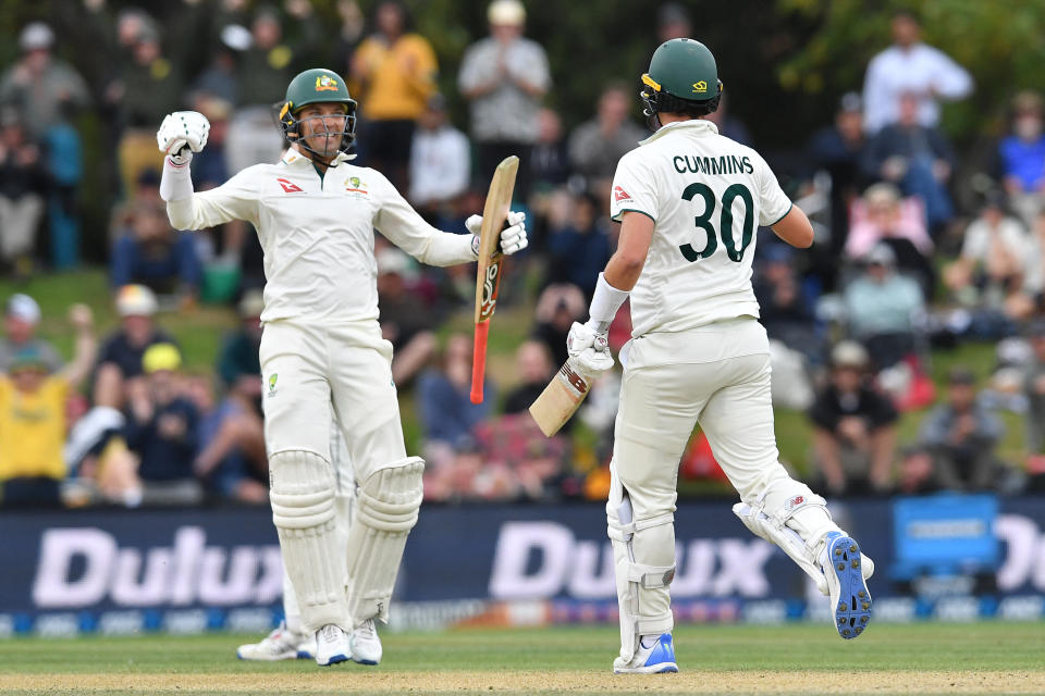 Australia's Pat Cummins (R) and Alex Carey celebrate their victory on day four of the second Test cricket match between New Zealand and Australia at Hagley Oval in Christchurch on March 11, 2024. (Photo by Sanka Vidanagama / AFP) (Photo by SANKA VIDANAGAMA/AFP via Getty Images)