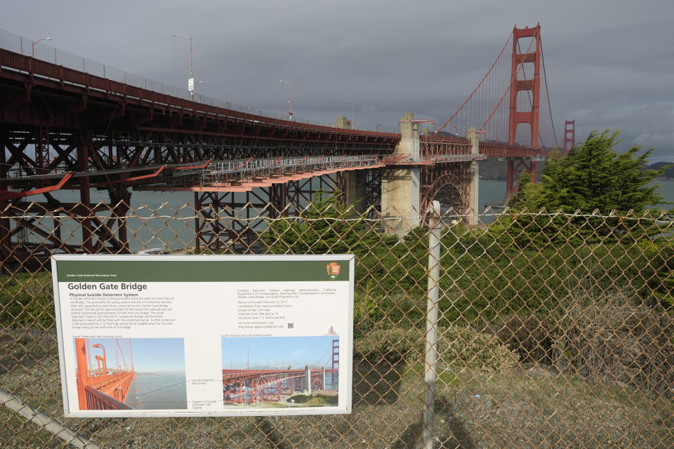 A suicide deterrent net is seen under construction on the Golden Gate Bridge in San Francisco, Wednesday, Dec. 6, 2023. The barrier at the bridge is near completion more than a decade after officials approved it. (AP Photo/Eric Risberg)