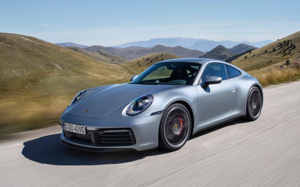 The undated photo provided by Porsche on Nov. 28, 2018 shows the new Porsche 911 Carrera 4S. Porsche unveiled the eighth generation of his emblematic sports car in Los Angeles. (Porsche via AP) - Porsche AG