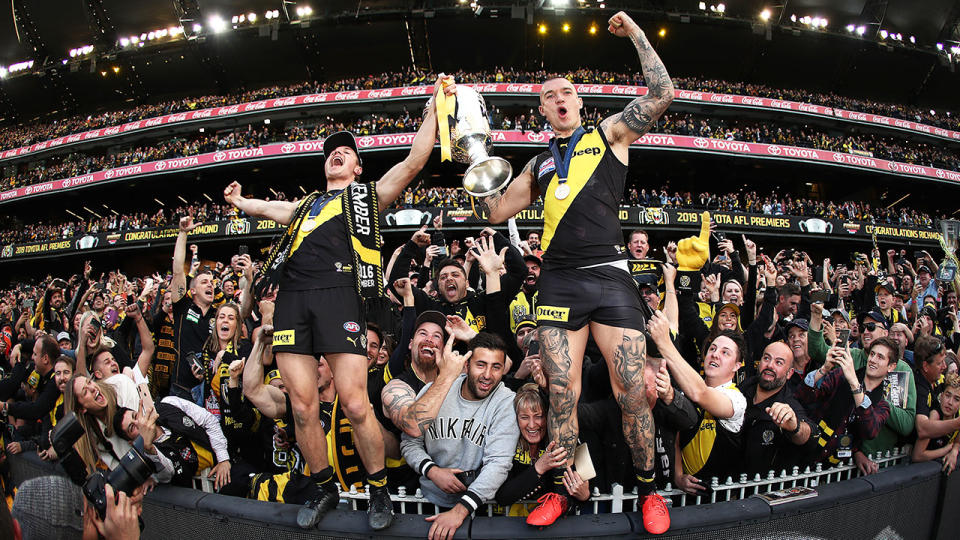 Seen here, Richmond star Dustin Martin celebrates his side's 2019 AFL premiership.