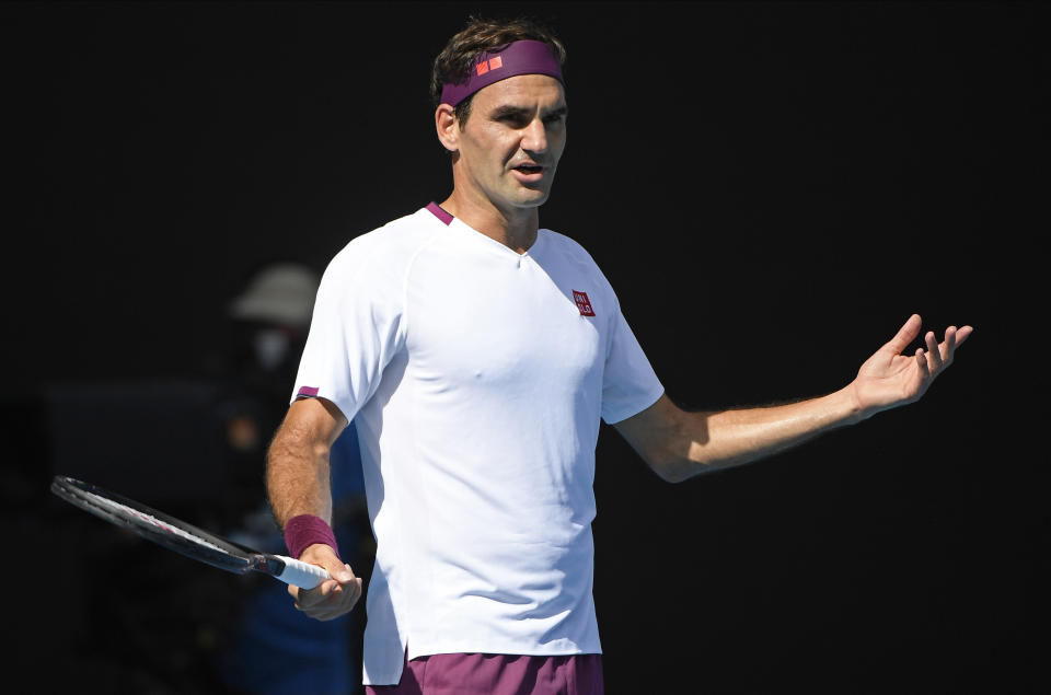 Switzerland's Roger Federer reacts during his quarterfinal against Tennys Sandgren of the U.S. at the Australian Open tennis championship in Melbourne, Australia, Tuesday, Jan. 28, 2020. (AP Photo/Andy Brownbill)
