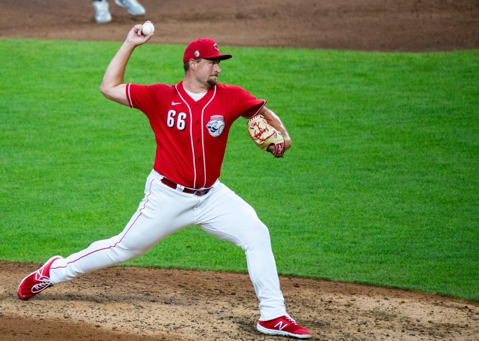 Jul 24, 2020; Cincinnati, Ohio, USA; Cincinnati Reds pitcher Joel Kuhnel pitches in the eighth inning of the MLB Interleague Preseason game between the Cincinnati Reds and the Detroit Tigers at Great American Ball Park. Mandatory Credit: Albert Cesare/Cincinnati Enquirer-USA TODAY Sports