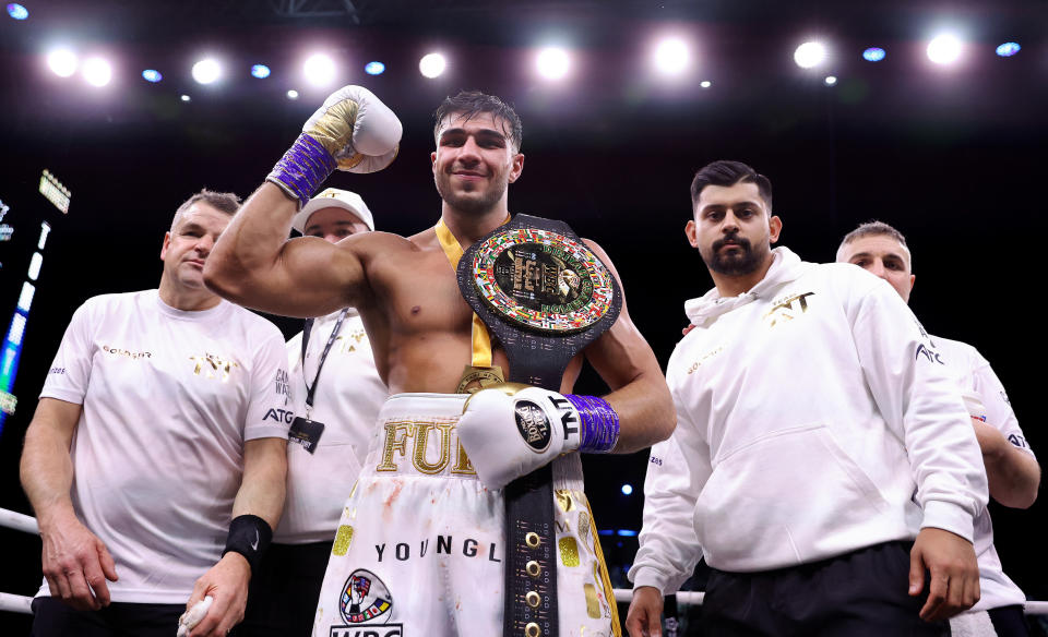 Tommy Fury, pictured here posing with his team after his win over Jake Paul.