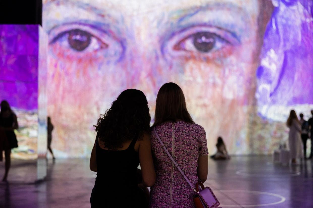 Visitors to the "Immersive Klimt" exhibition in Boston.