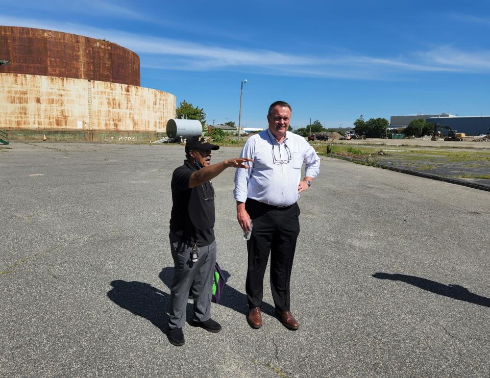 Community organizer John "Buddy" Andrade chats with Andrew Saunders, president of the New Bedford Foss Marine Terminal, during the Wind Works Pipeline Tour on Friday, June 17.