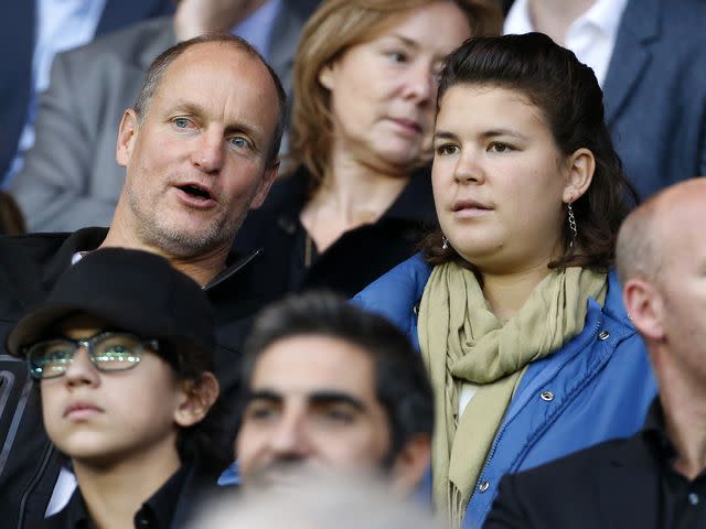 <p>Jean Catuffe/Getty </p> Woody Harrelson and Deni Harrelson attend the French Ligue 1 match between Paris Saint-Germain and Toulouse FC n November 7, 2015 in Paris, France.