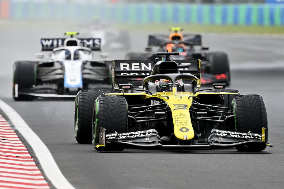 Renault's Australian driver Daniel Ricciardo steers his car in front of Williams' Canadian driver Nicholas Latifi (L) and Red Bull's Thai driver Alex Albon during the Formula One Hungarian Grand Prix race at the Hungaroring circuit in Mogyorod near Budapest, Hungary, on July 19, 2020. (Photo by Joe Klamar / POOL / AFP) (Photo by JOE KLAMAR/POOL/AFP via Getty Images)