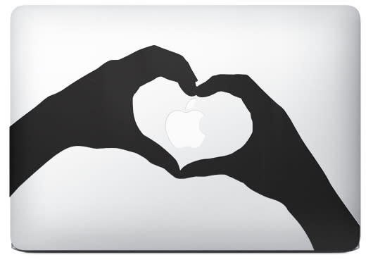 MacBook Air with Apple Logo and Stickers