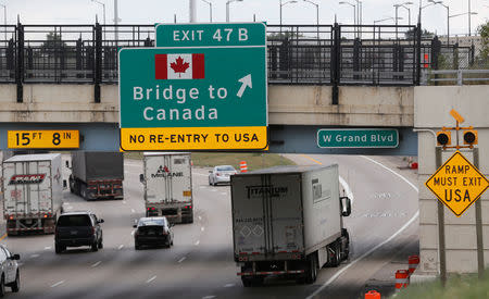 FILE PHOTO: A commercial truck exits the highway for the Bridge to Canada, in Detroit, Michigan U.S. August 30, 2018. REUTERS/Rebecca Cook