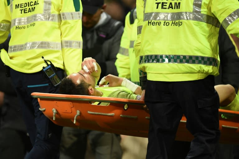 Members of the pitch medical team carry off Manchester City's goalkeeper Claudio Bravo on a stretcher after he got injured during the English Premier League football match April 27, 2017