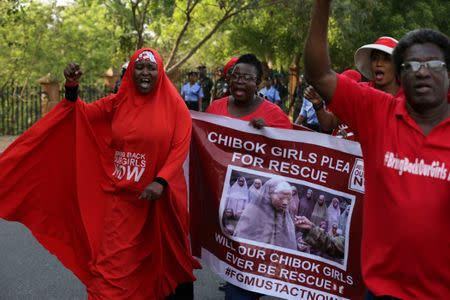 FILE PHOTO: Campaigners from the #BringBackOurGirls group protest in Nigeria's capital Abuja to mark 1,000 days since over 200 schoolgirls were kidnapped from their secondary school in Chibok by Islamist sect Boko Haram, Nigeria January 8, 2017. REUTERS/Afolabi Sotunde/File Photo