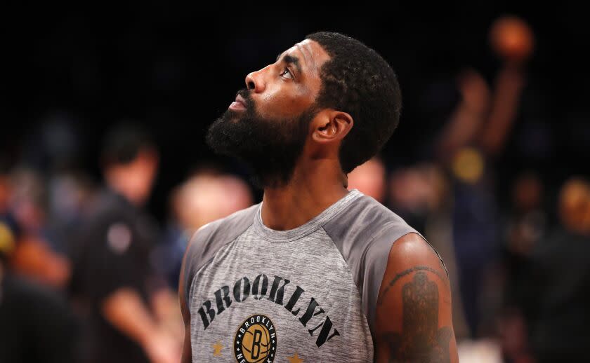 Brooklyn Nets guard Kyrie Irving (11) looks up during warm ups