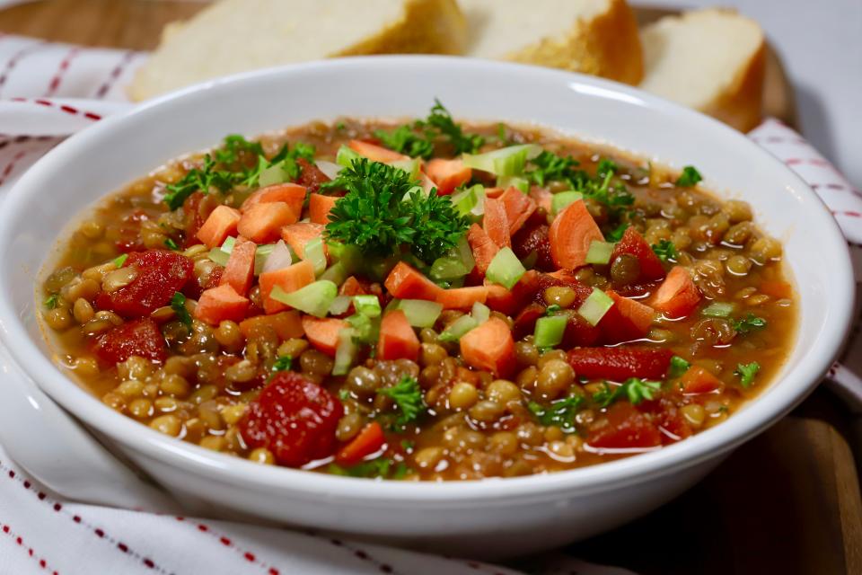 Per the USDA, 100 grams of cooked lentils contains 7.9 grams of fiber and 9 grams of protein. This lentil soup is topped with fresh carrots and celery for extra crunch and flavor.