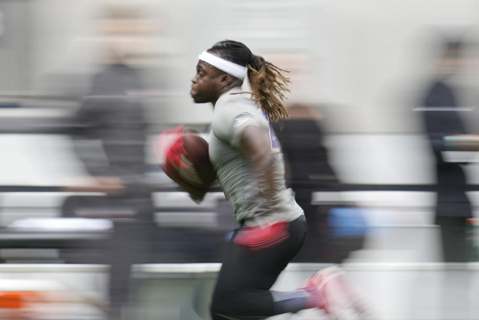 Running back Tyrese Johnson-Fisher, of the United Kingdom, takes part in the NFL International Combine at the Tottenham Hotspur Stadium in London, Tuesday, Oct. 4, 2022. International athletes on Tuesday are taking part in a series of tests in front of NFL evaluators for a potential position in the NFL's International Player Pathway programme. (AP Photo/Kin Cheung)