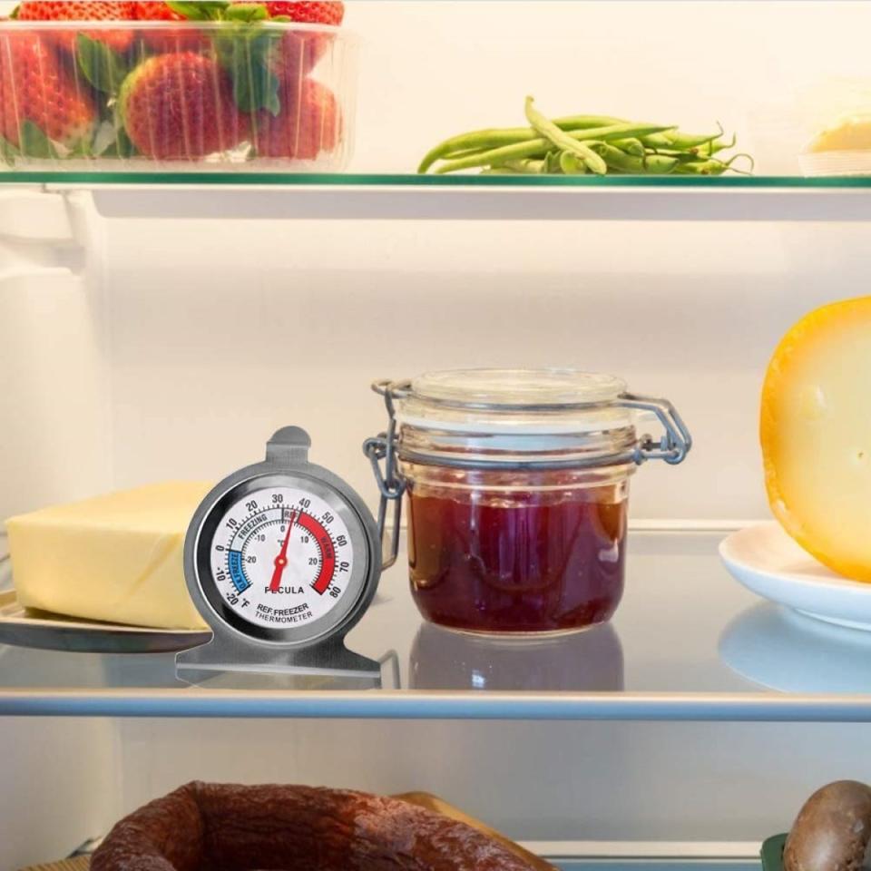 Product photo mockup of a refrigerator thermometer on a fridge shelf