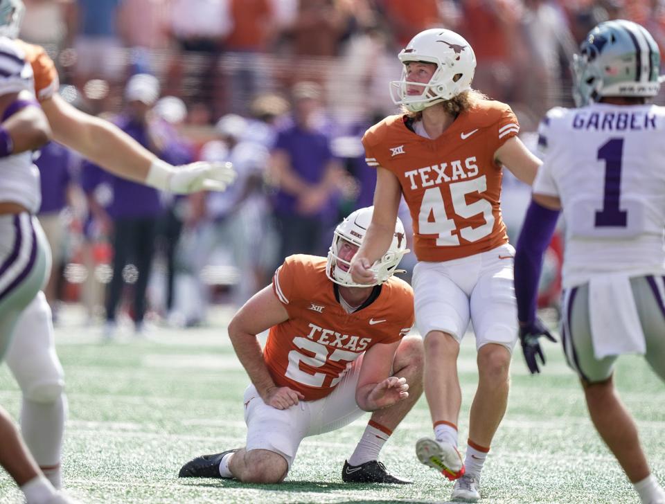 Texas kicker Bert Auburn watches one of his second-half field goals go through the uprights. His overtime field goal lifted the Longhorns to a 33-30 victory over Kansas State. It was the first game-winning kick of his UT career.