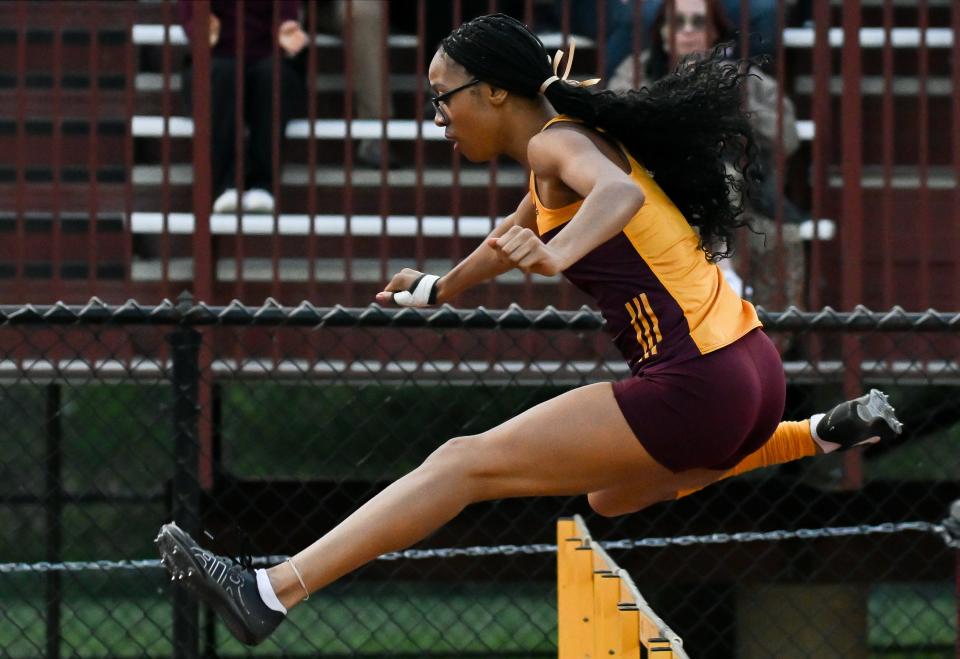 Bloomington North’s Dede Eberle wins the girls' 100 meter hurdles during the Conference Indiana track meet at Bloomington North on Friday, April 26, 2024.