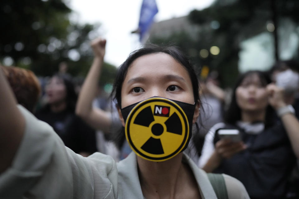 A member of environmental civic group shouts slogan during a rally to demand the withdrawal of the Japanese government's decision to release treated radioactive water into the sea from the damaged Fukushima nuclear power plant, in Seoul, South Korea, Tuesday, Aug. 22, 2023. Japan will start releasing treated and diluted radioactive wastewater from the Fukushima Daiichi nuclear plant into the Pacific Ocean as early as Thursday — a controversial step that the government says is essential for the decades of work needed to shut down the facility that had reactor meltdowns 12 years ago. (AP Photo/Lee Jin-man)