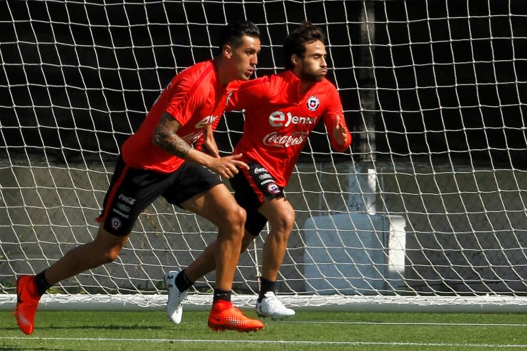 Chile's footballers Enzo Roco (L) and Jorge Valdivia take part in a team training session in Santiago, on March 21, 2017, ahead of their FIFA World Cup South American qualifier matches against Argentina and Venezuela