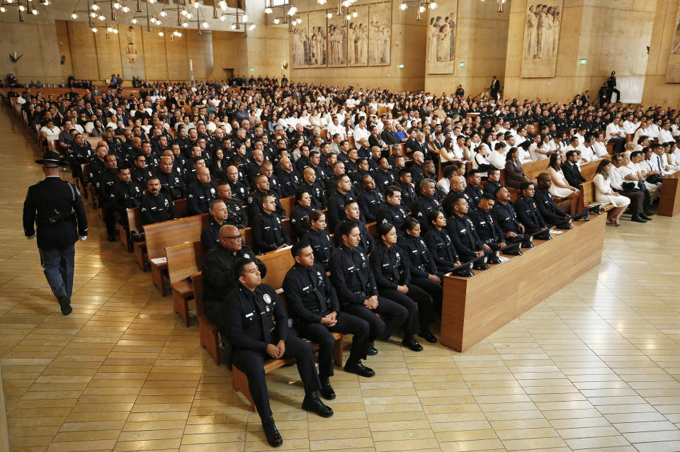 Law enforcement officers from various departments attend the Funeral Mass of slain Los Angeles Police Officer Juan Jose Diaz at the Cathedral of Our Lady of the Angeles Monday, Aug. 12, 2019, with Archbishop Jose H. Gomez presiding at the bilingual Mass. (Al Seib/Los Angeles Times via AP, Pool)