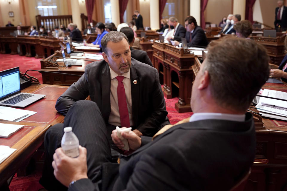 Republican gubernatorial candidate state Sen. Brian Dahle, left, talks with fellow GOP state Sen. Andreas Borgeas at the Capitol in Sacramento, Calif., Thursday, June 9, 2022. Dahle finished second in California's primary on June 7, and knows it will be hard to defeat incumbent Democratic Gov. Gavin Newsom. He plans to focus on what he says are the problems people care about the most, including high gas prices and rising crime. (AP Photo/Rich Pedroncelli)