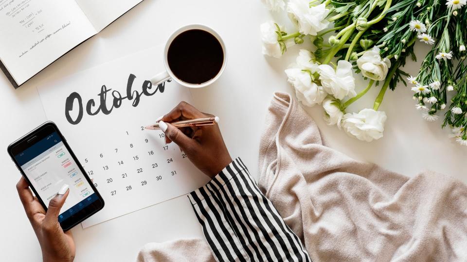 woman using calendar to schedule investments