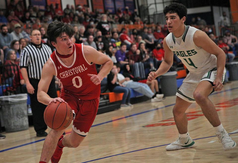 Christoval's Josh Fava, left, dribbles around Eldorado's Korbin Covarrubiaz during a playoff game in San Angelo on Friday, Feb. 26, 2021.