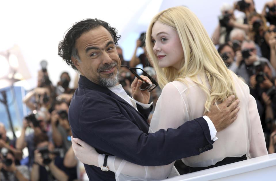 Jury president Alejandro Gonzalez Inarritu, left, and jury member Elle Fanning pose for photographers at the photo call for the jury at the 72nd international film festival, Cannes, southern France, Tuesday, May 14, 2019. (Photo by Vianney Le Caer/Invision/AP)