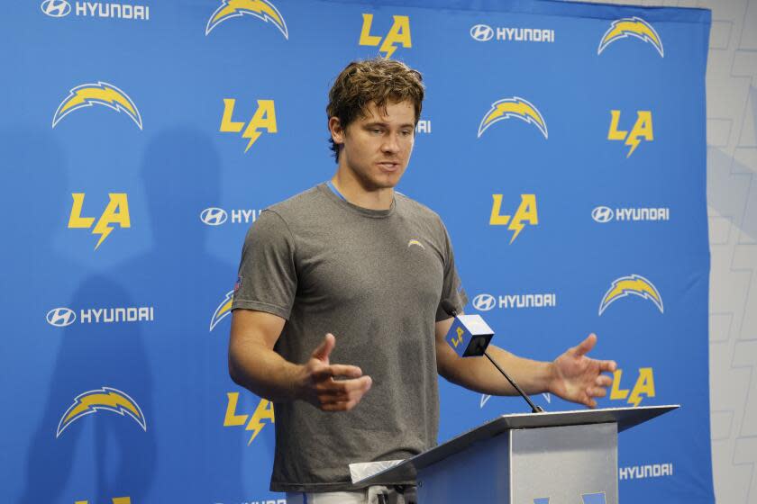 Chargers quarterback Justin Herbert speaks at a news conference for the first time in months.