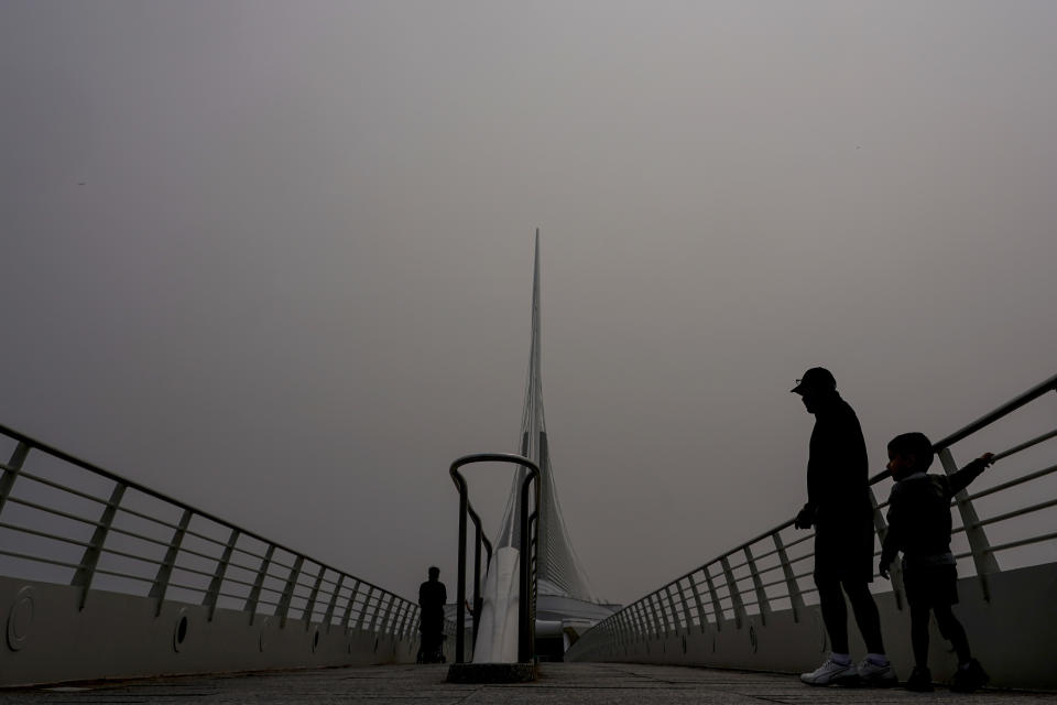 A haze is seen over the Milwaukee Art Museum, Tuesday, June 27, 2023, in Milwaukee. The haze from Canadian wildfires, which, along with higher ozone levels is continuing to create low visibility conditions and lead to air quality alerts throughout the area. (AP Photo/Morry Gash)