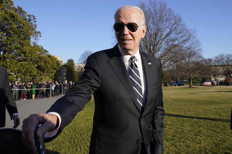 President Joe Biden talks with reporters on the South Lawn of the White House in Washington, Monday, Jan. 30, 2023, after returning from an event in Baltimore on infrastructure. (AP Photo/Susan Walsh)