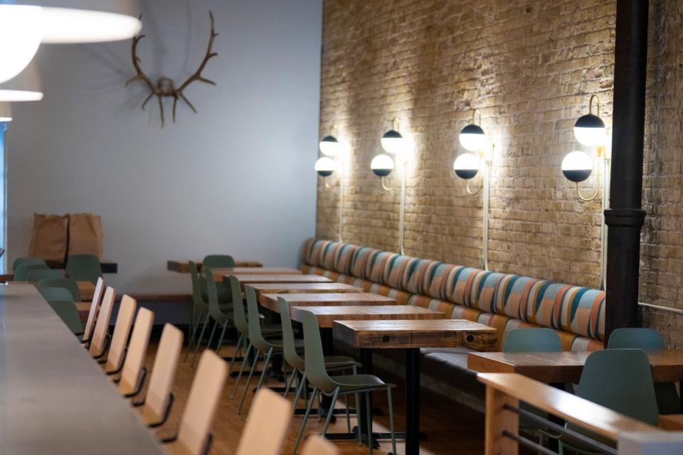Sconces line the Cream City brick wall at the new dining room of Bavette la Boucherie, 217 N. Broadway. The restaurant opens in its new location Friday; the last day at the old location on Menomonee Street was April 2.