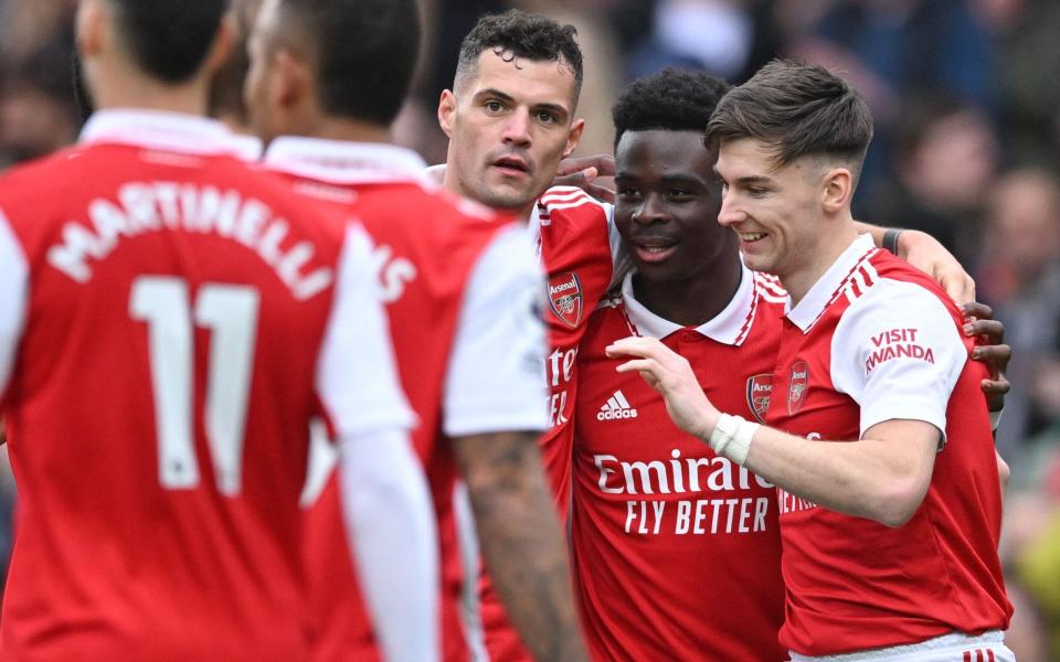 Bukayo Saka congratulated by his colleagues - AFP via Getty Images