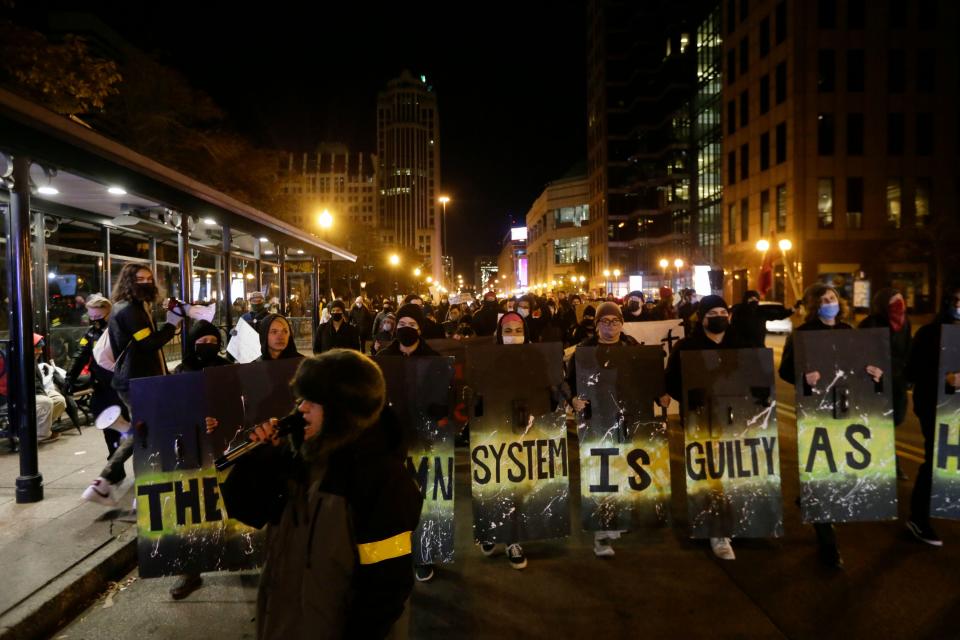 An organizer leads about 100 people onto the street during a protest to the Kyle Rittenhouse verdict outside of the Ohio Statehouse in Columbus, Ohio, on Friday, Nov. 19, 2021. “Indict, convict, send that killer kid to jail, the whole damn system is guilty as hell,” the people shouted.