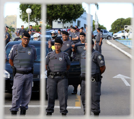 Military policemen stand inside their battalion during a police strike in Vitoria, Brazil February 11, 2017. REUTERS/Paulo Whitaker