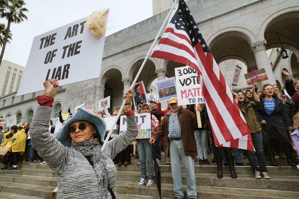 Copyright 2017 The Associated Press. All rights reserved. This material may not be published, broadcast, rewritten or redistributed without permission. Mandatory Credit: Photo by AP/REX/Shutterstock (8413591b) Anita Venegas stands with other protesters on the steps outside of Los Angeles City Hall on . Several hundred people gathered in front of Los Angeles City Hall this morning to express their opposition to President Donald Trump and take part in a ''Not My President's Day'' rally 'Not My President Day' protest, Los Angeles, USA - 20 Feb 2017