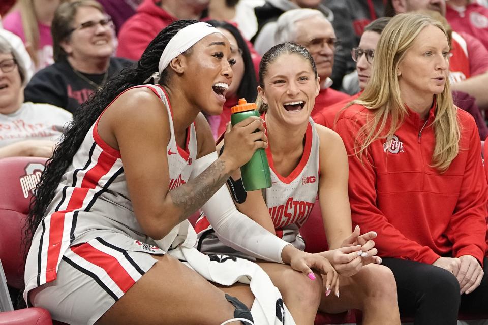 Ohio State's Cotie McMahon, left, and Jacy Sheldon sing along to a Taylor Swift song on the bench during the second half of a win over Nebraska on Feb. 14.
