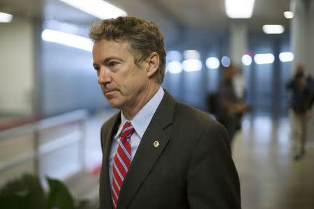 U.S. Senator Rand Paul (R-KY) arrives for votes on the Senate floor at the U.S. Capitol in Washington December 12, 2014. REUTERS/Jonathan Ernst