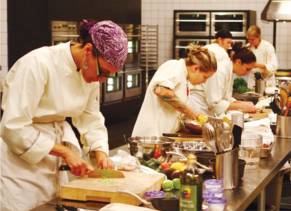 From left: Carla Hall, Jamie Lauren and Leah Cohen cooking a Thanksgiving meal for members of the Foo Fighters in season five.