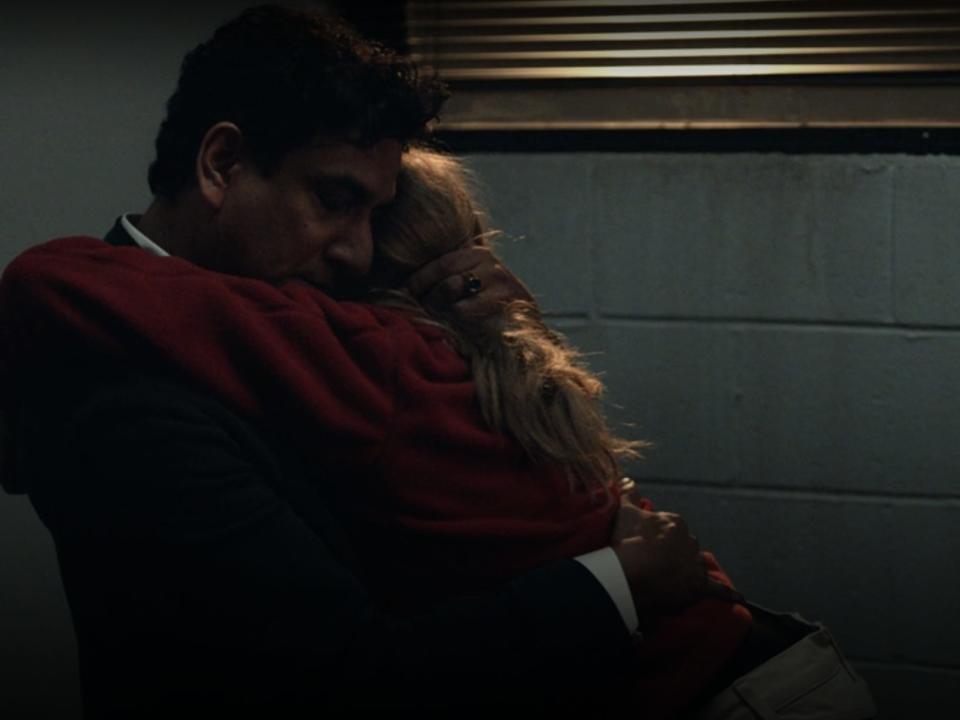 a hug between Amanda Seyfried as Elizabeth Holmes and Naveen Andrews as Ramesh "Sunny" Balwani in The Dropout