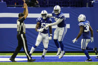 Indianapolis Colts defensive end Justin Houston (50) and defensive tackle DeForest Buckner (99) celebrates a safety against the New York Jets in the second half of an NFL football game in Indianapolis, Sunday, Sept. 27, 2020. (AP Photo/AJ Mast)